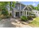 Two-story home with manicured landscaping, long driveway and basketball hoop at 2708 Halfhitch Trl, Raleigh, NC 27615