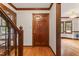 Foyer with hardwood floors and dark wood trim; view to dining and living rooms at 2708 Halfhitch Trl, Raleigh, NC 27615