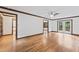 Spacious living room with hardwood floors, ceiling fan, and French doors leading to the backyard at 2708 Halfhitch Trl, Raleigh, NC 27615