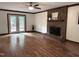 Hardwood floors, brick fireplace, and french doors to wooden deck in bright living room at 2708 Halfhitch Trl, Raleigh, NC 27615