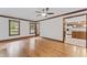 Bright living room with hardwood floors, wood trim, and a view into the open kitchen area at 2708 Halfhitch Trl, Raleigh, NC 27615