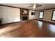 Spacious living room with a brick fireplace, hardwood floors, and natural light at 2708 Halfhitch Trl, Raleigh, NC 27615