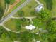 Bird's-eye view showcasing a home nestled among trees with lush landscaping and neighboring homes dotting the scenery at 2815 Orange Grove Rd, Hillsborough, NC 27278