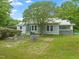 Lush backyard featuring a well-manicured lawn and garden beds at 2815 Orange Grove Rd, Hillsborough, NC 27278