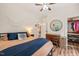 Comfortable bedroom featuring hardwood floors, a closet, and a decorative mirror at 2815 Orange Grove Rd, Hillsborough, NC 27278