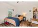 Cozy bedroom with natural light, hardwood floors, and charming decor at 2815 Orange Grove Rd, Hillsborough, NC 27278