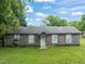 Single-story building with neutral-colored brick and multiple windows at 2815 Orange Grove Rd, Hillsborough, NC 27278