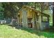 Rustic chicken coop in a wooded area with mesh wire and a secure structure at 2815 Orange Grove Rd, Hillsborough, NC 27278