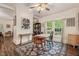 Charming dining room featuring hardwood floors, shiplap accent walls, and a stylish ceiling fan at 2815 Orange Grove Rd, Hillsborough, NC 27278