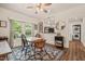 Bright dining area with a floral rug, window views, and easy access to the kitchen and laundry at 2815 Orange Grove Rd, Hillsborough, NC 27278