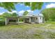 Charming home exterior with a covered carport and well-maintained lawn at 2815 Orange Grove Rd, Hillsborough, NC 27278