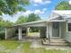 Charming home featuring a carport and covered entrance, nestled in a tranquil setting at 2815 Orange Grove Rd, Hillsborough, NC 27278
