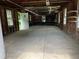 Large unfinished garage area offering ample storage and workshop potential at 2815 Orange Grove Rd, Hillsborough, NC 27278