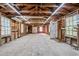 Spacious garage with concrete floor, wood construction, lighting, and windows at 2815 Orange Grove Rd, Hillsborough, NC 27278