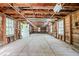 Spacious garage with concrete floor, wood construction, work benches, lighting, and windows at 2815 Orange Grove Rd, Hillsborough, NC 27278