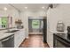 Contemporary kitchen with stainless steel appliances, wooden floors, and an open layout at 2815 Orange Grove Rd, Hillsborough, NC 27278