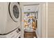 Laundry area and a bathroom with a patterned shower curtain featuring a washing machine and dryer at 2815 Orange Grove Rd, Hillsborough, NC 27278