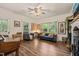 Bright living room with wood floors, elegant decor, and comfortable seating, creating a welcoming atmosphere at 2815 Orange Grove Rd, Hillsborough, NC 27278