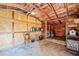 Shed interior with wood frame, shelving, concrete floor, and storage at 2815 Orange Grove Rd, Hillsborough, NC 27278