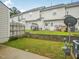 Backyard featuring a small lawn area, privacy fence, and patio at 2845 Bennington Dr, Clayton, NC 27520