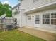 Exterior view of the backyard with privacy fence, patio, and minimal landscaping at 2845 Bennington Dr, Clayton, NC 27520