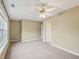Neutral bedroom with ceiling fan, carpet, and neutral paint at 2845 Bennington Dr, Clayton, NC 27520