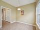 Dining room features modern lighting, neutral paint, and laminate flooring at 2845 Bennington Dr, Clayton, NC 27520