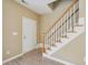 Inviting foyer area with staircase, light walls, and door at 2845 Bennington Dr, Clayton, NC 27520