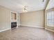 Spacious living room featuring a cozy fireplace, neutral paint, and modern floors at 2845 Bennington Dr, Clayton, NC 27520