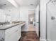 Bright bathroom with a granite countertop vanity, walk-in shower, and an open doorway to the bedroom at 304 Azalea Gaze Dr, Youngsville, NC 27596