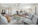 Open-concept living space including a kitchen, dining area and a comfortable seating arrangement at 304 Azalea Gaze Dr, Youngsville, NC 27596