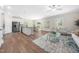 Open-concept living space with stainless steel appliances and dining area, perfect for entertaining at 304 Azalea Gaze Dr, Youngsville, NC 27596