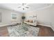 Bright and airy living area with stylish furniture, a ceiling fan, and natural light from the window at 304 Azalea Gaze Dr, Youngsville, NC 27596
