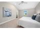 Well-lit main bedroom with vaulted ceiling, neutral carpet, and a view to the ensuite bathroom at 304 Azalea Gaze Dr, Youngsville, NC 27596
