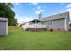 View of the home's back exterior, deck, gazebo, and storage shed at 308 E Quailwood Dr, Fuquay Varina, NC 27526