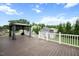 Large deck with gazebo and view of the backyard and storage shed at 308 E Quailwood Dr, Fuquay Varina, NC 27526