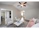Inviting living room showcasing wood flooring, neutral decor, and a cozy seating arrangement at 308 E Quailwood Dr, Fuquay Varina, NC 27526