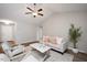 Cozy living room featuring a vaulted ceiling, neutral color palette, and inviting seating arrangement at 308 E Quailwood Dr, Fuquay Varina, NC 27526