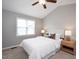 Serene main bedroom with a vaulted ceiling, soft carpet, and a comfortable king-sized bed with accent lamps at 308 E Quailwood Dr, Fuquay Varina, NC 27526