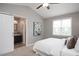 Cozy bedroom with vaulted ceiling featuring access to ensuite bathroom via sliding barn door at 308 E Quailwood Dr, Fuquay Varina, NC 27526