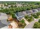 Aerial view highlighting the property's location amidst mature trees in a suburban neighborhood at 324 Farrow Glen Loop, Cary, NC 27519