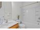Well lit bathroom featuring a single sink, toilet, and bathtub-shower combo at 324 Farrow Glen Loop, Cary, NC 27519