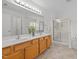 Bathroom featuring double sinks, bathtub, and walk-in shower with glass door at 324 Farrow Glen Loop, Cary, NC 27519
