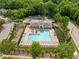 Aerial view of a community pool with lounge chairs and lush landscaping at 324 Farrow Glen Loop, Cary, NC 27519