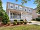 Lovely two-story home with a charming front porch and well-kept landscaping in a suburban setting at 324 Farrow Glen Loop, Cary, NC 27519