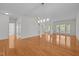 Bright and spacious living area with hardwood floors, ample lighting, and access to the upper level at 324 Farrow Glen Loop, Cary, NC 27519