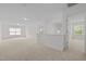 Open-concept loft with neutral carpet, and ample natural light at 324 Farrow Glen Loop, Cary, NC 27519
