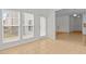 Bright sunroom featuring tiled floors and multiple windows allowing for an abundance of natural light at 324 Farrow Glen Loop, Cary, NC 27519