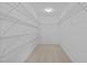 Spacious walk-in closet featuring custom wire shelving, maximizing storage efficiency at 324 Farrow Glen Loop, Cary, NC 27519