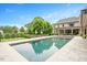 Expansive pool and meticulously maintained backyard, creating a serene and private outdoor oasis at 3347 Alamance Dr, Raleigh, NC 27609